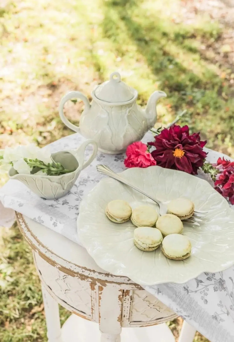 French macarons served at an elegant garden tea table